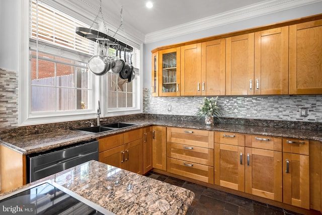 1125 K St NE, Washington, DC 20002 - kitchen with dishwasher, decorative backsplash, dark stone counters, brown cabinetry, and ornamental molding