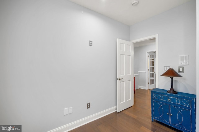 1125 K St NE, Washington, DC 20002 - empty room with a smoke detector and wood finished floors