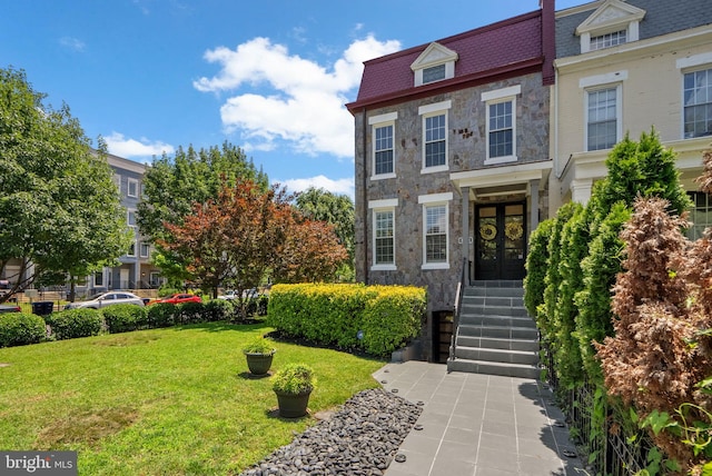 1125 K St NE, Washington, DC 20002 - view of front of house featuring stone siding, a front lawn, french doors, and a high end roof