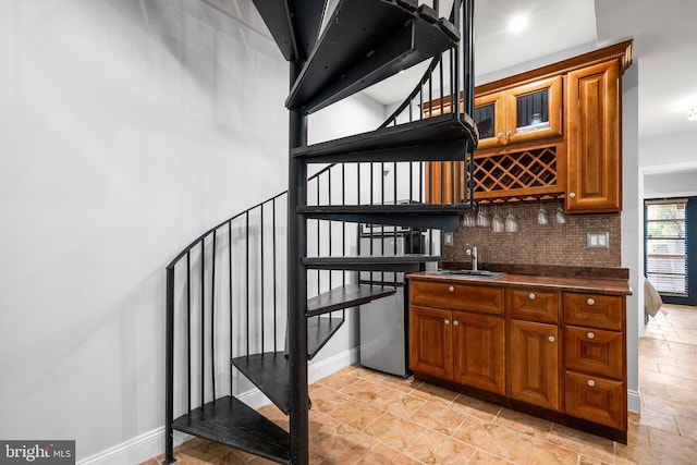1125 K St NE, Washington, DC 20002 - indoor wet bar featuring stairs and tasteful backsplash