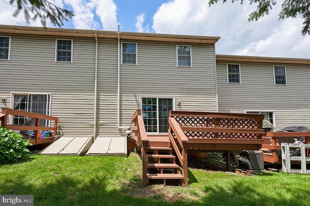 1206 Fredrick Blvd, Reading, PA 19605 - back of house featuring a deck and a lawn