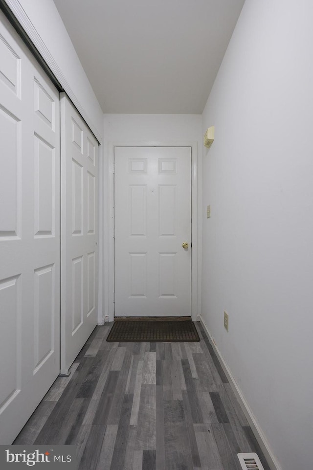 1206 Fredrick Blvd, Reading, PA 19605 - doorway to outside with dark wood-style floors and baseboards