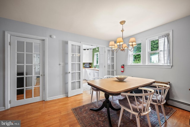148 Reservoir Rd, Hopewell, NJ 08525 - dining space featuring a chandelier, light wood-style floors, and french doors