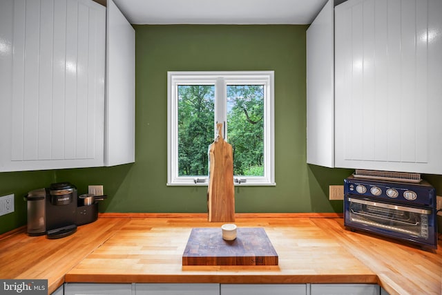 148 Reservoir Rd, Hopewell, NJ 08525 - kitchen featuring butcher block counters, white cabinets, and wood finished floors
