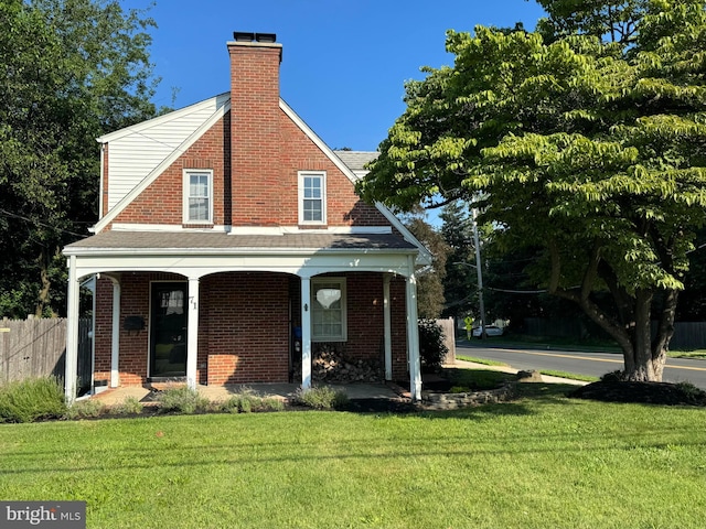 71 Homestead Ave, Hamilton, NJ 08610 - view of front of house with a chimney, brick siding, covered porch, and a shingled roof