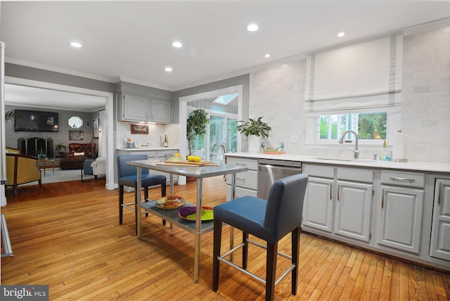 15508 Summer Grove Ct, Gaithersburg, MD 20878 - kitchen featuring gray cabinetry, crown molding, decorative backsplash, light wood-style floors, and light countertops