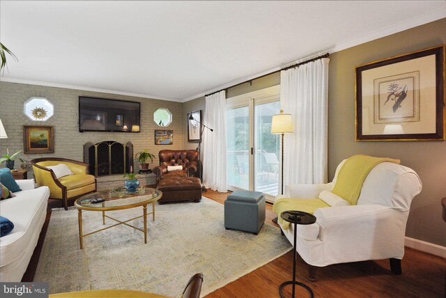 15508 Summer Grove Ct, Gaithersburg, MD 20878 - living room featuring ornamental molding, wood finished floors, a fireplace, and brick wall