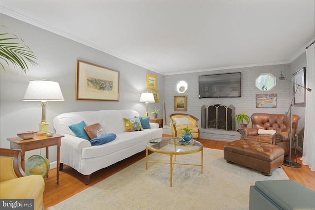 15508 Summer Grove Ct, Gaithersburg, MD 20878 - living area with wood finished floors, a fireplace, ornamental molding, and brick wall