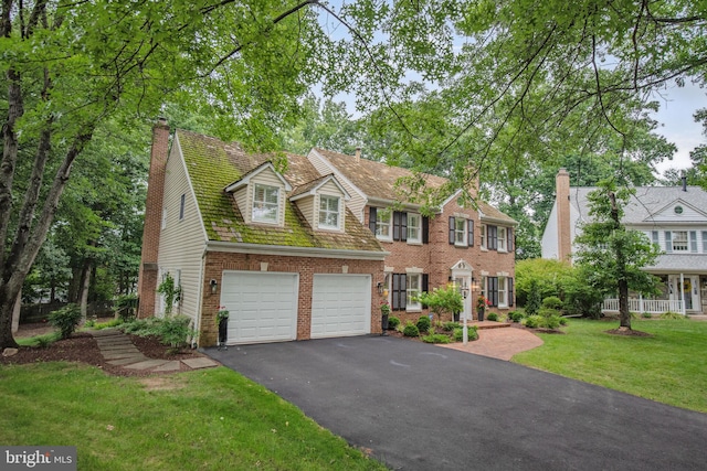 15508 Summer Grove Ct, Gaithersburg, MD 20878 - colonial-style house with brick siding, driveway, a chimney, a front lawn, and an attached garage