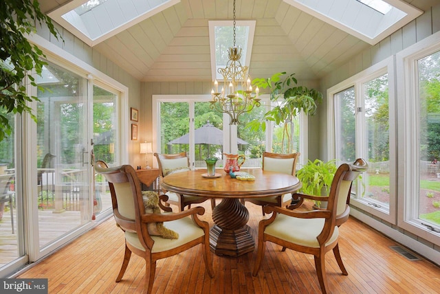 15508 Summer Grove Ct, Gaithersburg, MD 20878 - sunroom / solarium with a skylight, hardwood / wood-style flooring, vaulted ceiling, french doors, and wood walls