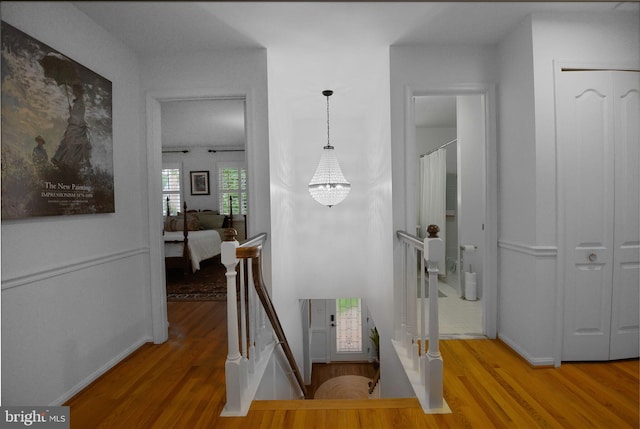 15508 Summer Grove Ct, Gaithersburg, MD 20878 - corridor featuring an upstairs landing, wood finished floors, and a chandelier