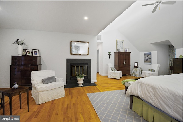 15508 Summer Grove Ct, Gaithersburg, MD 20878 - bedroom featuring a fireplace with flush hearth, wood finished floors, lofted ceiling, ceiling fan, and recessed lighting