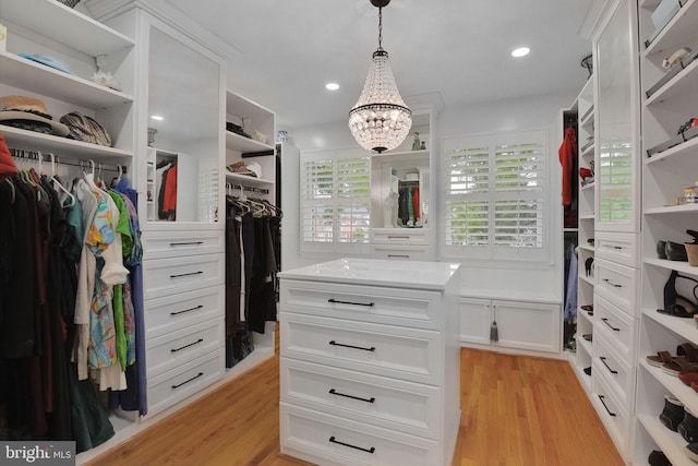 15508 Summer Grove Ct, Gaithersburg, MD 20878 - walk in closet with light wood-style floors and a chandelier