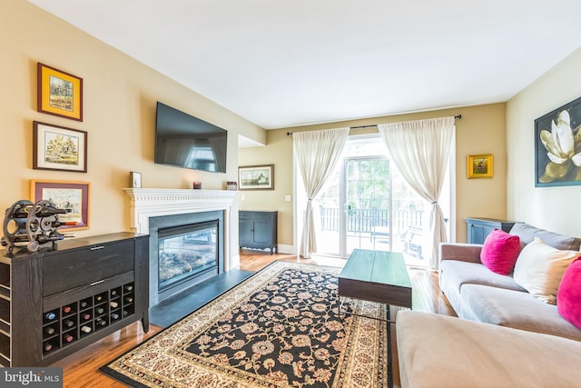 231 Caleb Dr, West Chester, PA 19382 - living area featuring wood finished floors and a glass covered fireplace