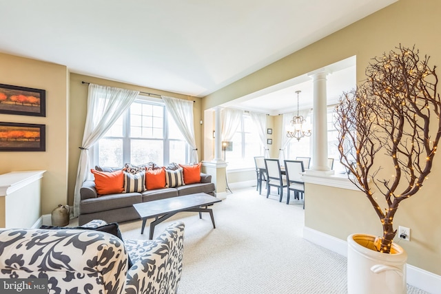 231 Caleb Dr, West Chester, PA 19382 - carpeted living area featuring ornate columns and a chandelier