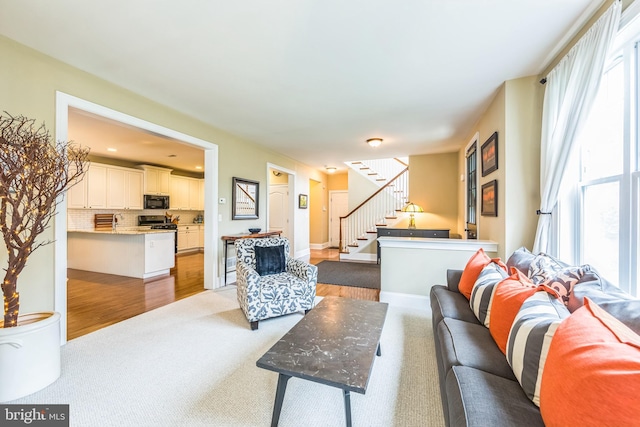 231 Caleb Dr, West Chester, PA 19382 - carpeted living room with stairs and healthy amount of natural light