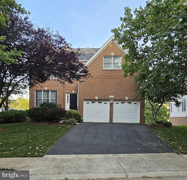 19874 La Bete Ct, Ashburn, VA 20147 - view of front of property featuring driveway, brick siding, an attached garage, a front lawn, and a shingled roof