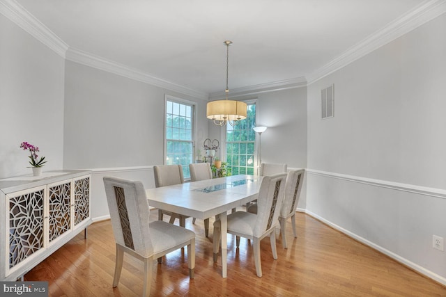 19874 La Bete Ct, Ashburn, VA 20147 - dining room with crown molding, wood finished floors, and a chandelier