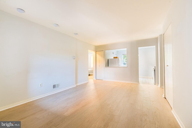 410 Main St Unit 9, Laurel, MD 20707 - spare room featuring light wood-type flooring and baseboards