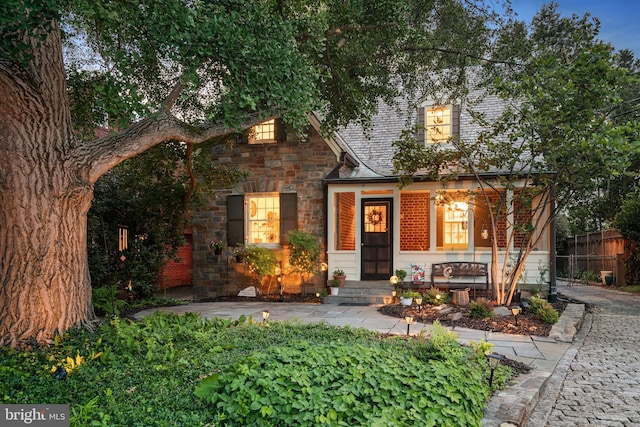 2833 Northampton St NW, Washington, DC 20015 - view of front of home featuring stone siding and a porch