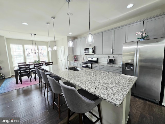 921 Sandy Run Rd, Baltimore, MD 21220 - kitchen with stainless steel appliances, a kitchen island with sink, dark wood-style flooring, backsplash, and recessed lighting
