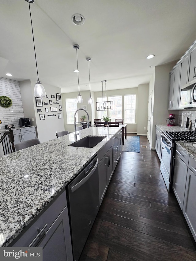 921 Sandy Run Rd, Baltimore, MD 21220 - kitchen featuring stainless steel appliances, gray cabinetry, tasteful backsplash, dark wood-style flooring, and recessed lighting