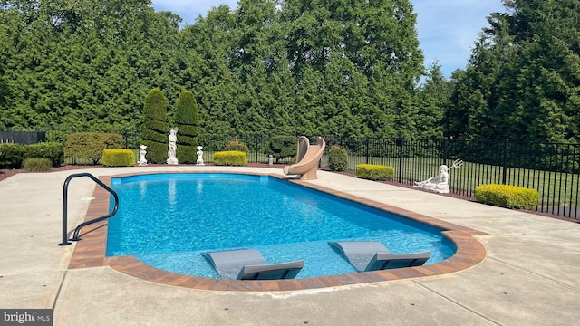 908 W S St, Smyrna, DE 19977 - view of swimming pool with a water slide and a patio area