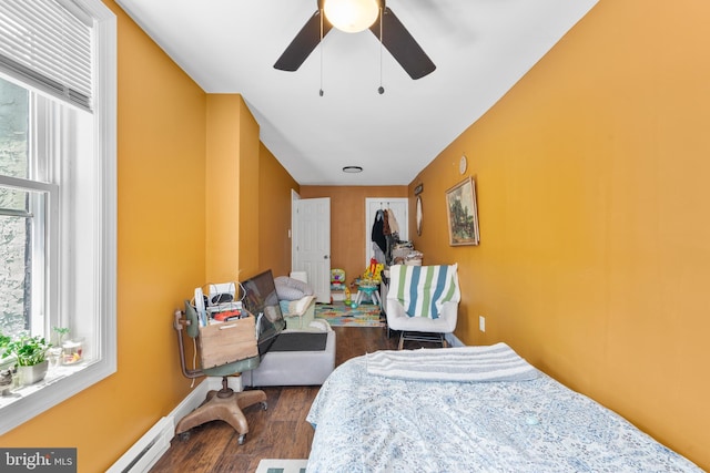 3567 Joyce St, Philadelphia, PA 19134 - bedroom featuring dark wood-style floors, ceiling fan, and baseboard heating