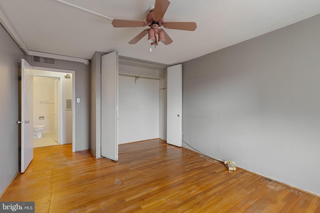 1101 Saint Paul St Unit 603, Baltimore, MD 21202 - unfurnished bedroom featuring light wood-style flooring, a closet, and a ceiling fan