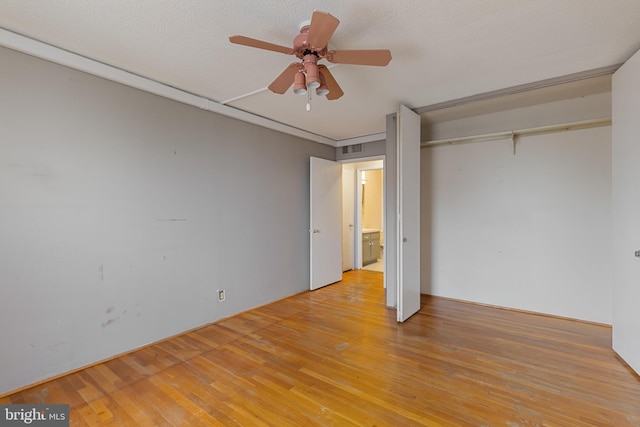 1101 Saint Paul St Unit 603, Baltimore, MD 21202 - unfurnished bedroom featuring light wood finished floors, ceiling fan, and a closet
