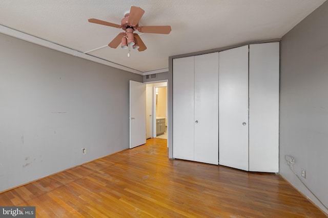 1101 Saint Paul St Unit 603, Baltimore, MD 21202 - unfurnished bedroom with light wood finished floors, a closet, and ceiling fan