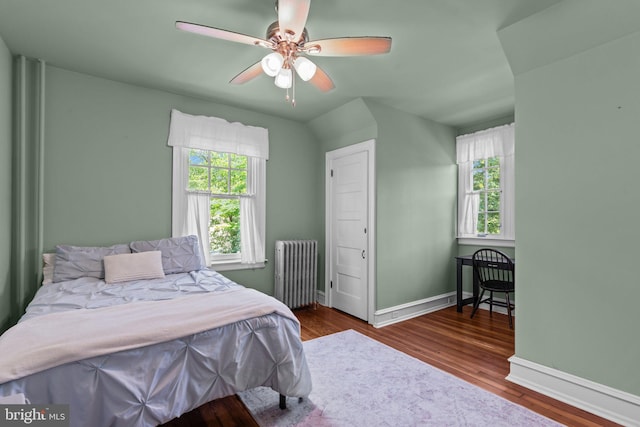 101 Cliff Ter, Wyncote, PA 19095 - bedroom with radiator heating unit, multiple windows, wood finished floors, and ceiling fan