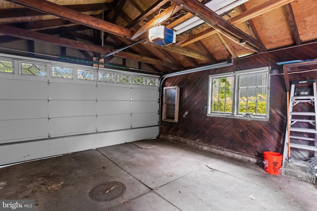 101 Cliff Ter, Wyncote, PA 19095 - garage featuring a garage door opener and wooden walls