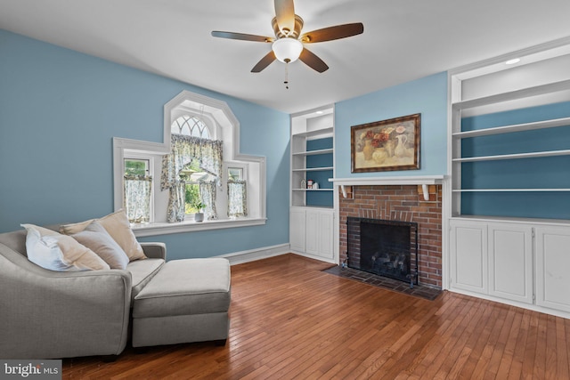 101 Cliff Ter, Wyncote, PA 19095 - living area featuring ceiling fan, hardwood / wood-style flooring, built in shelves, and a fireplace