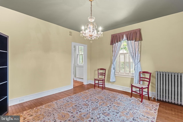 101 Cliff Ter, Wyncote, PA 19095 - sitting room featuring radiator heating unit, wood finished floors, and a chandelier