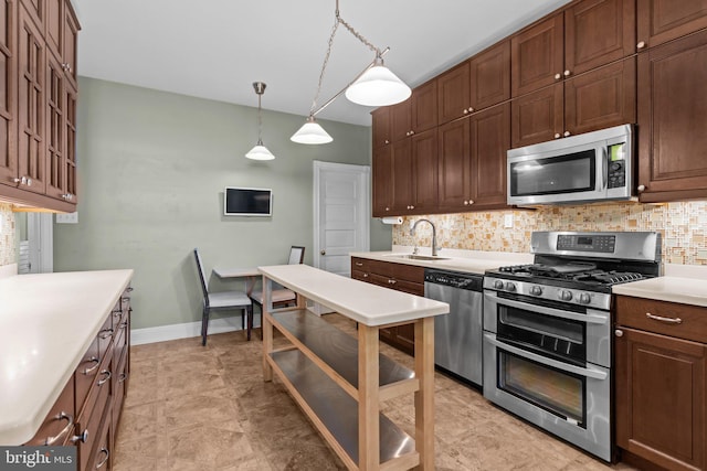 101 Cliff Ter, Wyncote, PA 19095 - kitchen featuring stainless steel appliances, decorative backsplash, light countertops, and glass insert cabinets