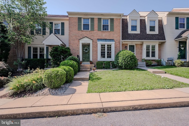 642 Lamplighter Way, Hockessin, DE 19707 - multi unit property with brick siding, a front lawn, and a shingled roof