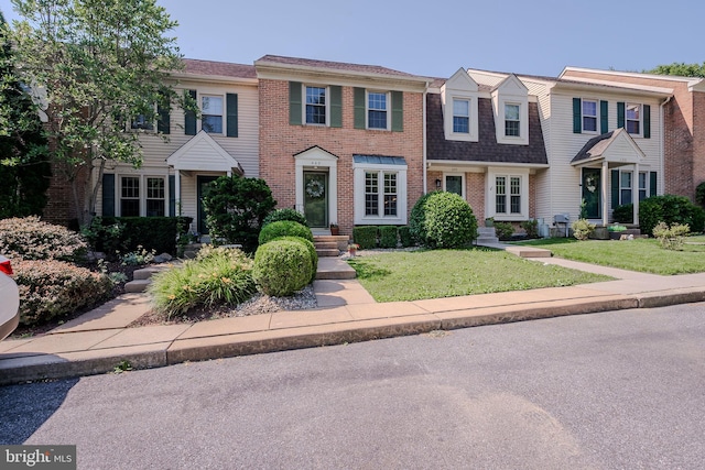 642 Lamplighter Way, Hockessin, DE 19707 - view of property with a front lawn, brick siding, and roof with shingles