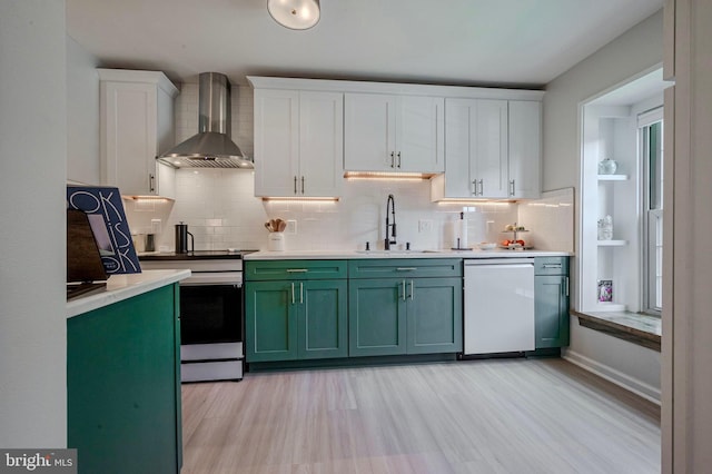 642 Lamplighter Way, Hockessin, DE 19707 - kitchen featuring wall chimney exhaust hood, dishwasher, green cabinets, stainless steel electric range, and white cabinetry