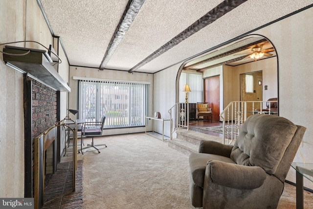 21 Hemmings Way, Lawnside, NJ 08045 - carpeted living room featuring a fireplace and a textured ceiling
