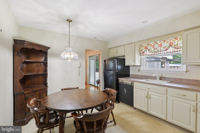 21 Hemmings Way, Lawnside, NJ 08045 - kitchen featuring black appliances, healthy amount of natural light, light floors, and decorative light fixtures