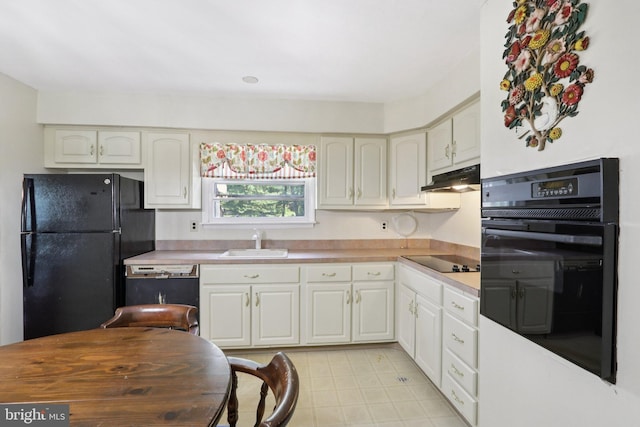 21 Hemmings Way, Lawnside, NJ 08045 - kitchen featuring black appliances, under cabinet range hood, light countertops, and white cabinets