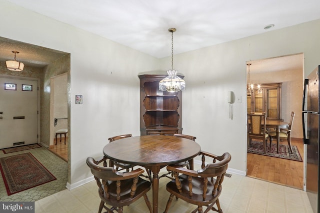 21 Hemmings Way, Lawnside, NJ 08045 - dining area featuring light flooring and a chandelier