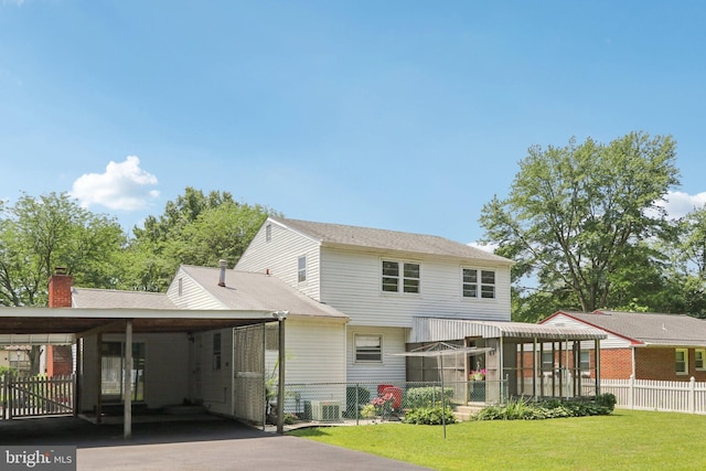 21 Hemmings Way, Lawnside, NJ 08045 - view of front facade with a carport, asphalt driveway, and a chimney