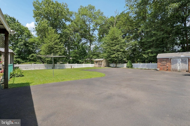 21 Hemmings Way, Lawnside, NJ 08045 - view of yard featuring a storage shed and view of wooded area