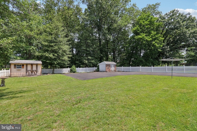 21 Hemmings Way, Lawnside, NJ 08045 - fenced backyard featuring a storage unit