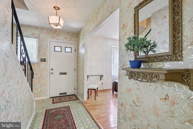 21 Hemmings Way, Lawnside, NJ 08045 - entryway featuring plenty of natural light, wallpapered walls, and a textured ceiling