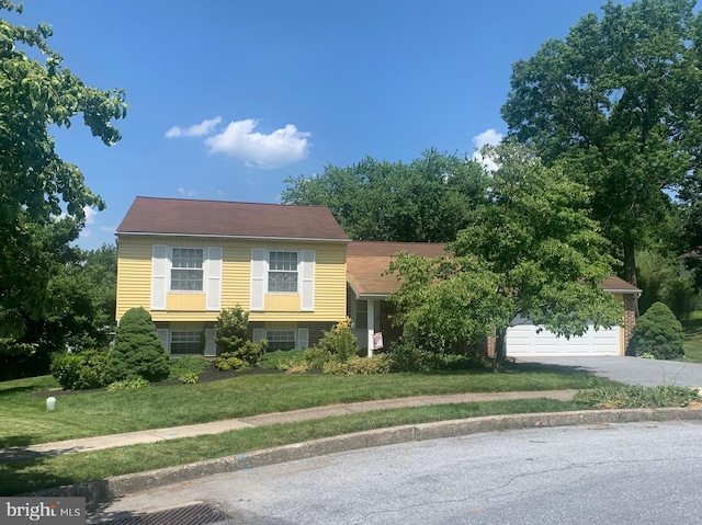 4784 Sweetbrier Ter, Harrisburg, PA 17111 - view of front facade featuring a garage, asphalt driveway, and a front yard