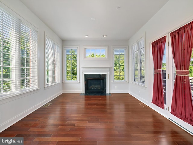 7730 Terraview Ct, Hanover, MD 21076 - unfurnished living room with healthy amount of natural light, wood finished floors, recessed lighting, and a fireplace with flush hearth