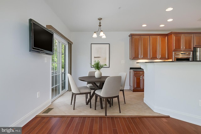 7730 Terraview Ct, Hanover, MD 21076 - dining area with light wood-style flooring and recessed lighting